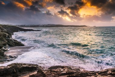 Sunset over crashing ocean currents
